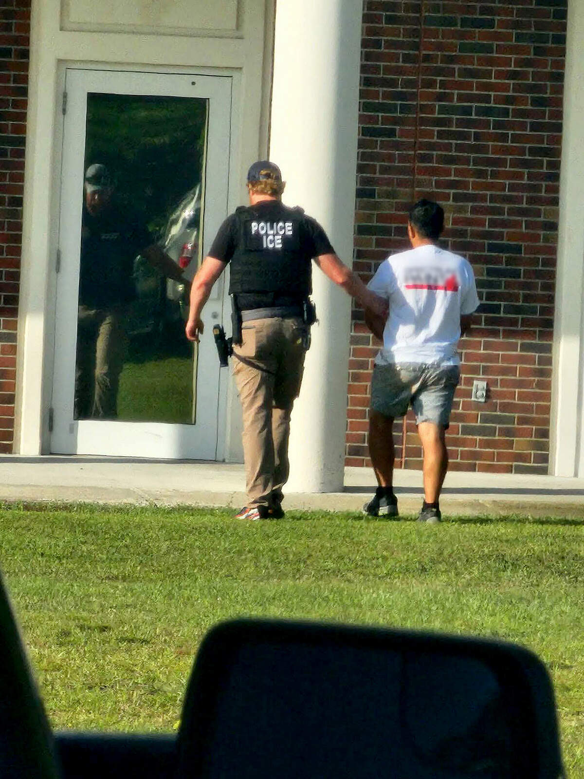 According to a witness, officers with the Beaufort County Sheriff’s Office and the South Carolina Law Enforcement Division (SLED) assisted U.S. Immigration and Customs Enforcement (ICE) agents in taking several people into custody on May 29, 2026, at the Myrtle Park Government Center on Bluffton Parkway in Bluffton.