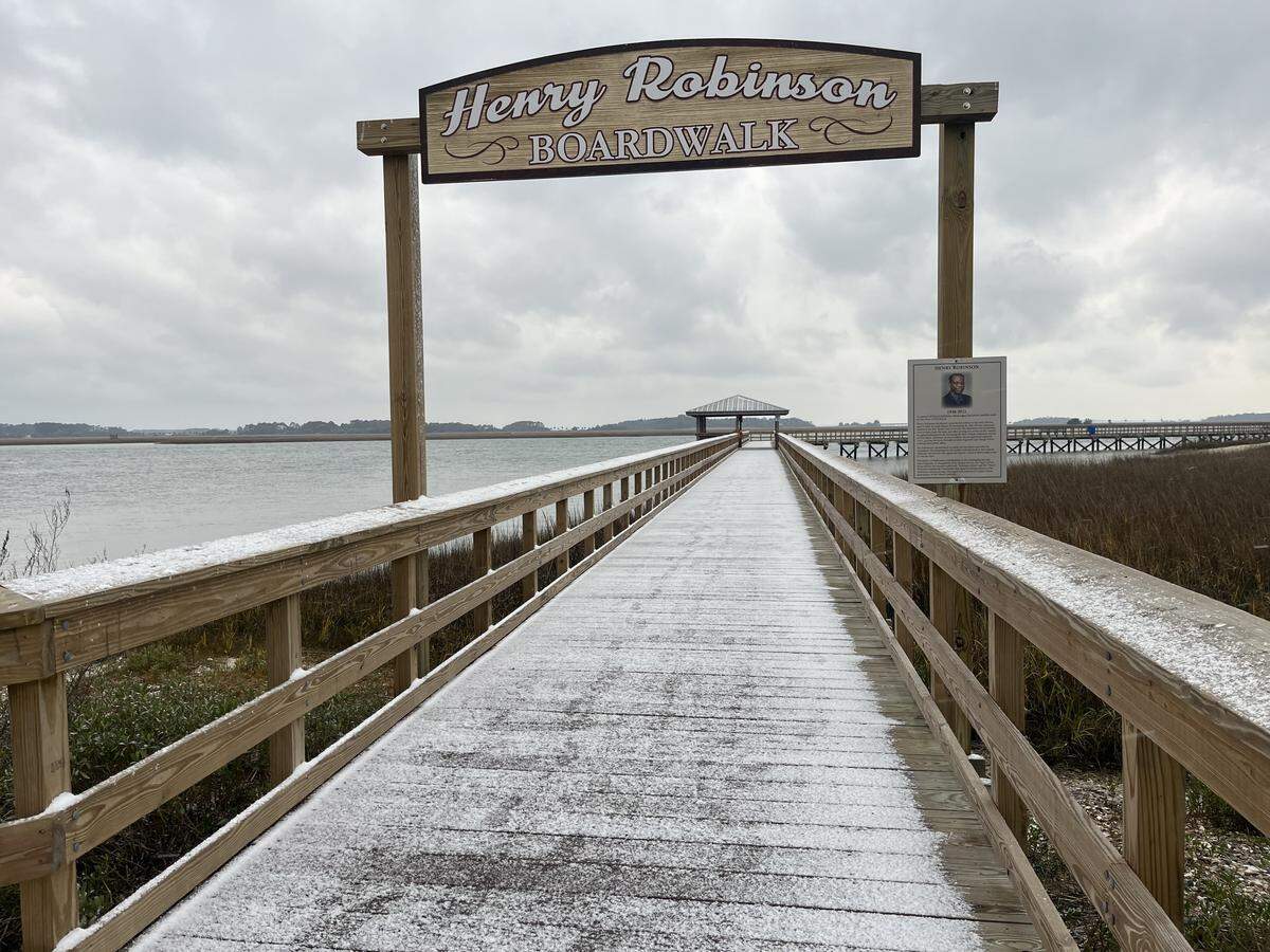 Snow frosted the Henry Robinson Boardwalk in Port Royal at 5 p.m. Saturday.