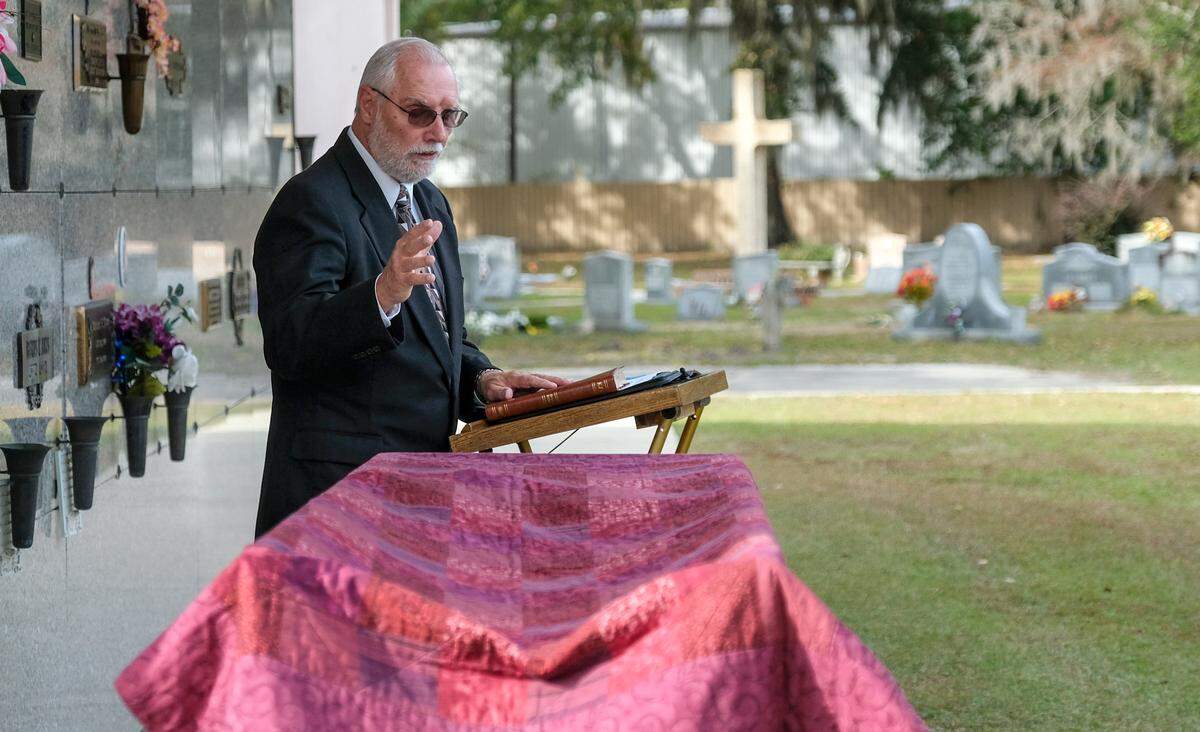 Waymond Duke, pastor of St. Helena Baptist Church, eulogizes the cremains of 30 unclaimed persons on Thursday, Nov. 18, 2021 at Forest Lawn Cemetery in Beaufort. When asked if he would give a sermon, Duke said he “didn’t hesitate” and said yes right away.