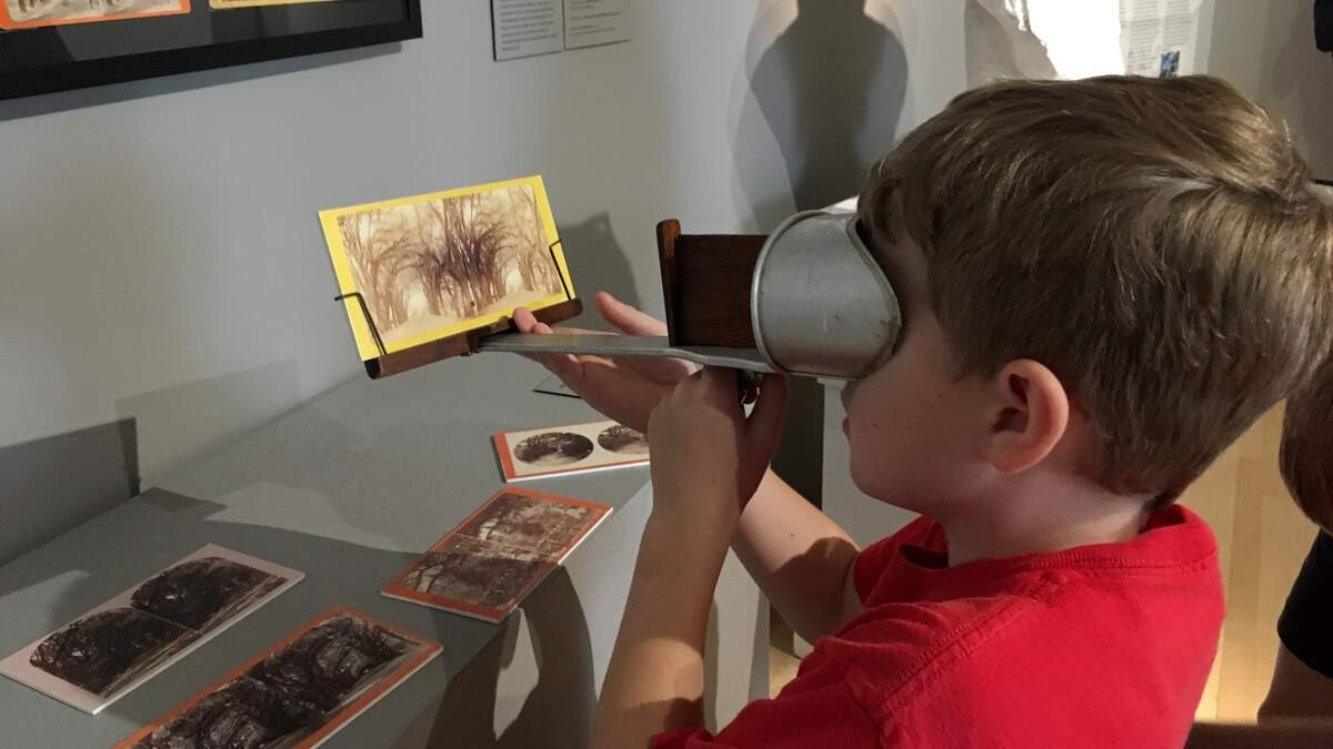 . A young visitor marvels at an antique stereoscope at the Telfair Museum’s Jepson Center in Savannah, proving that in an age of electronic entertainment, simple things still maintain an appeal.