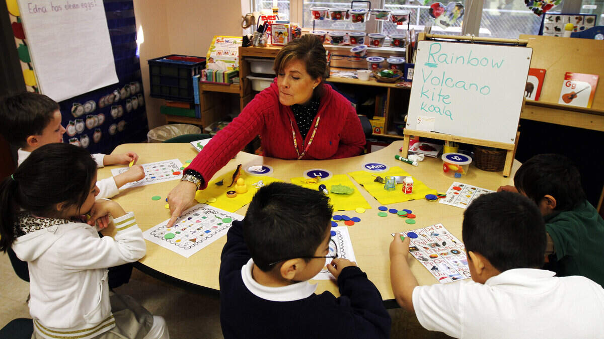 FILE: Meghan Brockmann, a pre-K teacher at Hilton Head Island Early Childhood Center, works with students on a pre-reading exercise Feb. 14, 2014.