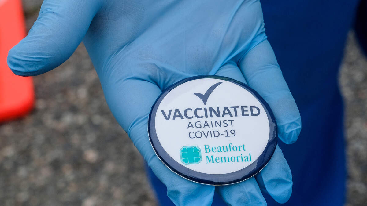 Registered Nurses with Beaufort Memorial Hospital handed out these buttons on Thursday, Jan. 21, 2021 to those that received their first dose of the Pfizer vaccine at the drive-thru clinic in the parking lot at Beaufort High School’s stadium.