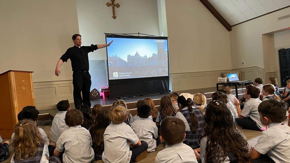 Father Andrew Trapp and students at St. Peter’s Catholic Church on Lady’s Island watch a live feed from Vatican City Thursday when a new pope was chosen.