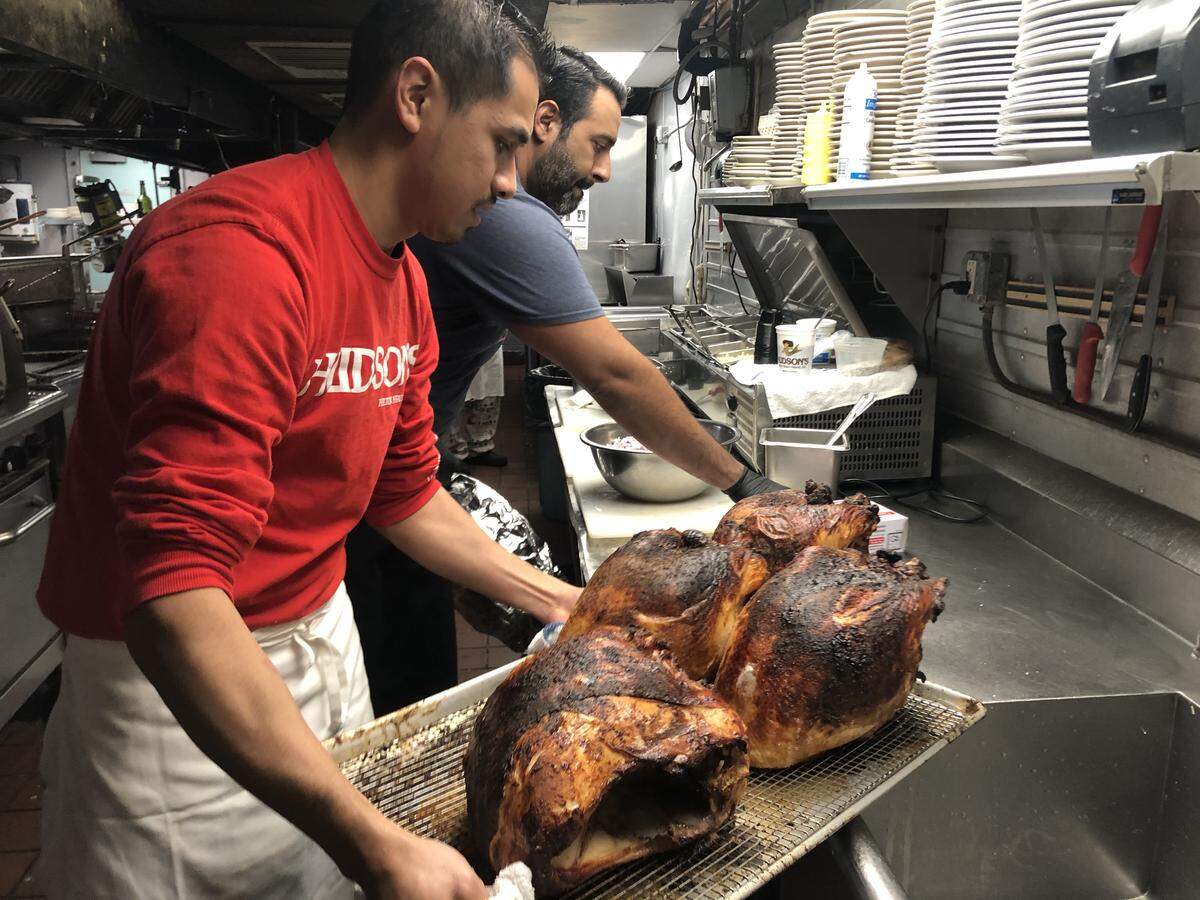 Isaac Jimenez, the executive chef at Hudson’s Seafood on the Docks, volunteers his time to prepare 97 turkeys for the annual Hilton Head Community Thanksgiving dinner. Preparation starts 7 days before the holiday meal.