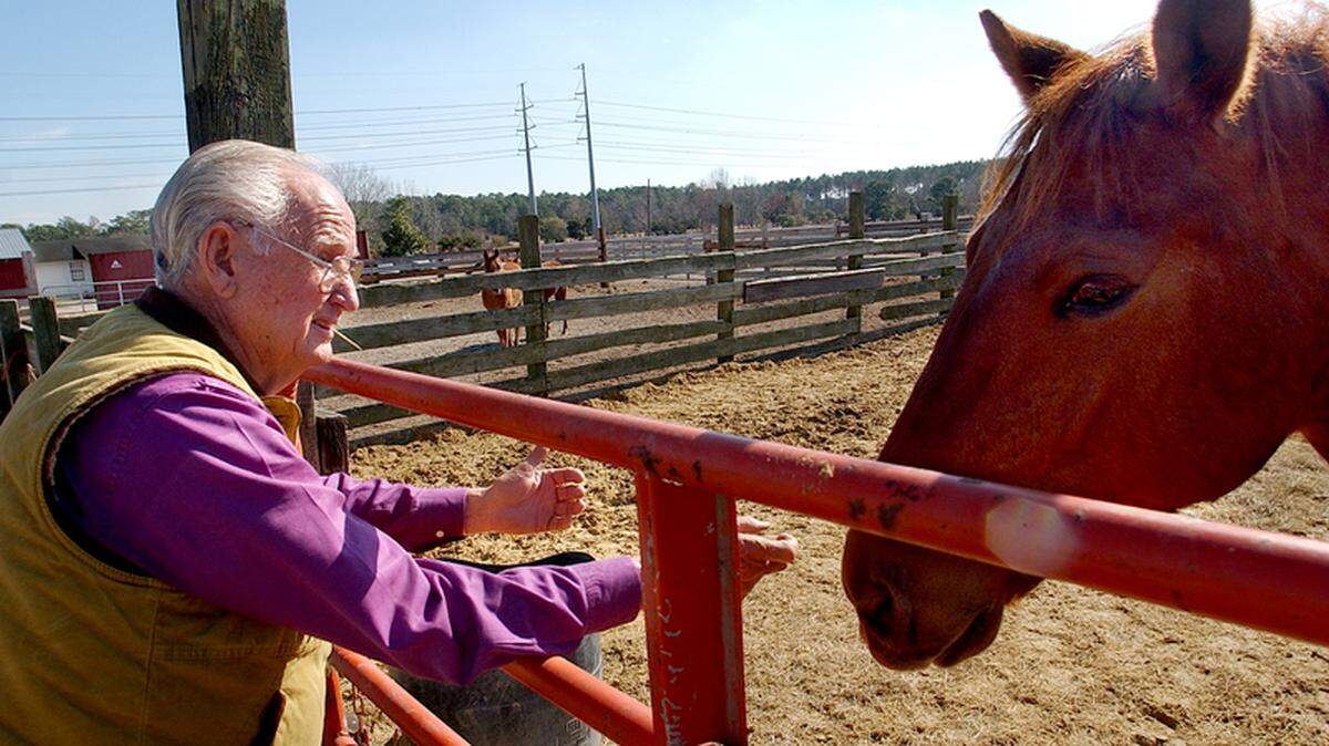 D.P. Lowther is pictured at his farm in Ridgeland in 2009 with his marsh tacky Slader. 
