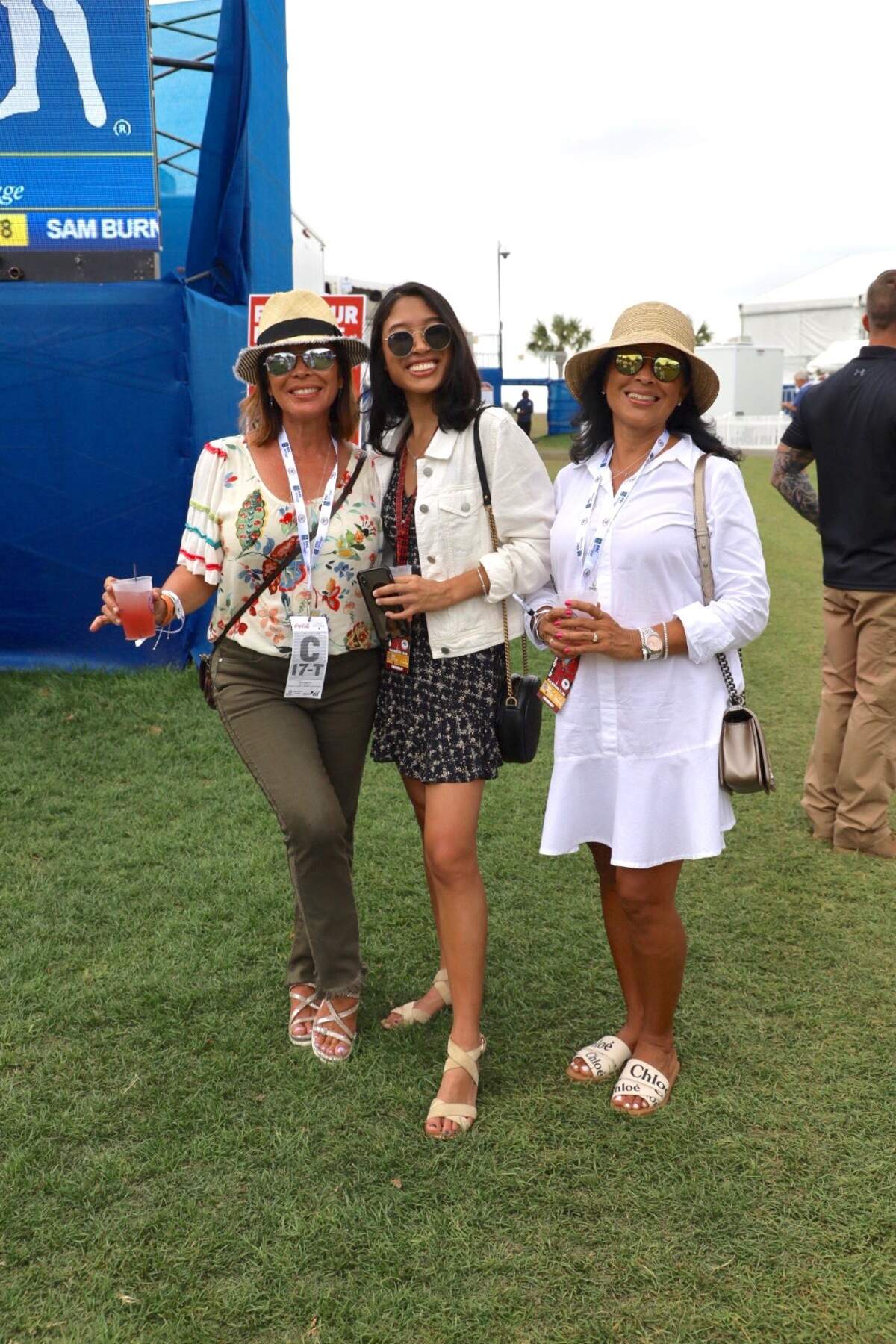 The Delacruz-Weitzner family coordinates in neutral colors and hats.