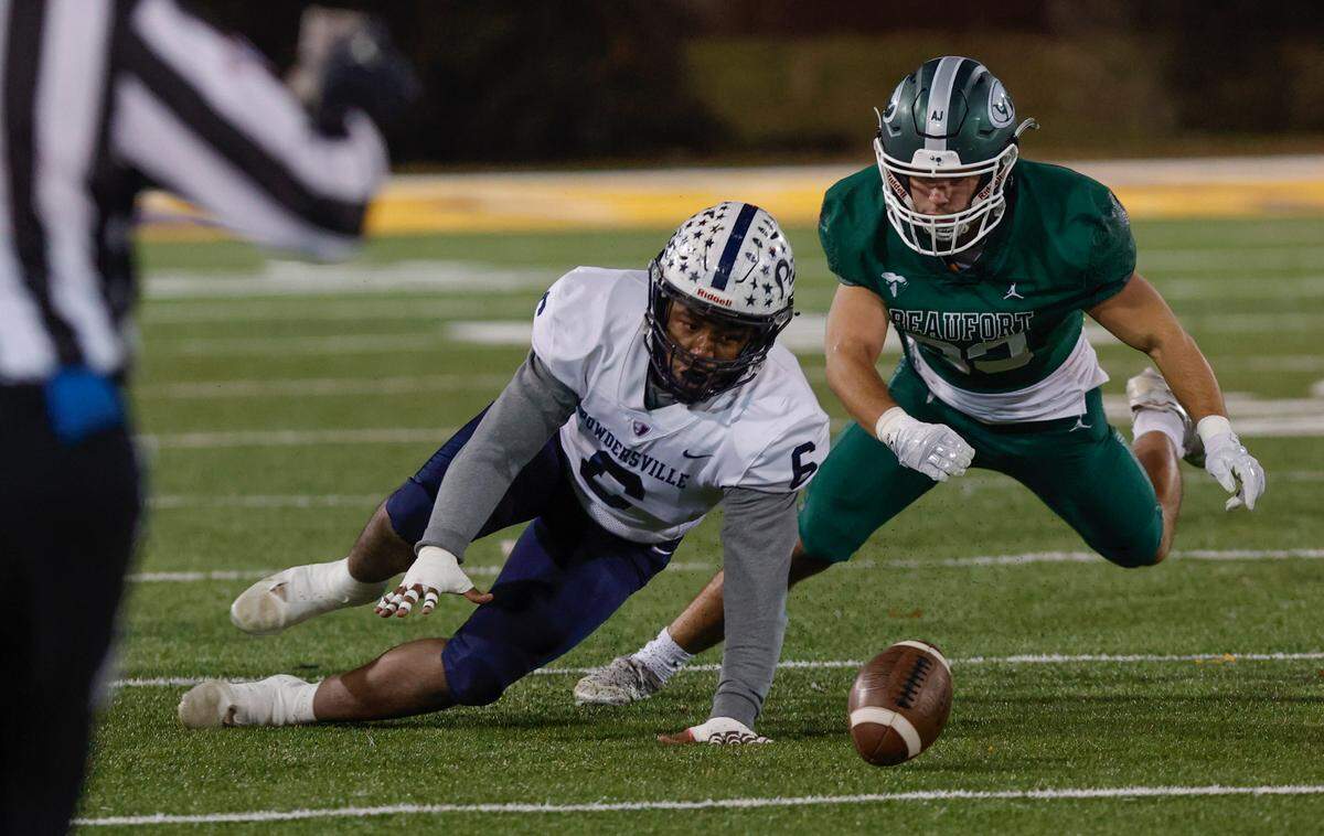 Powdersville’s rez Fowler (6) and Beaufort’s Zach Talbert (6) try to recover a fumble during the 3A State Championship game at Charles W. Johnson Stadium at Benedict College. Dec. 1, 2022.