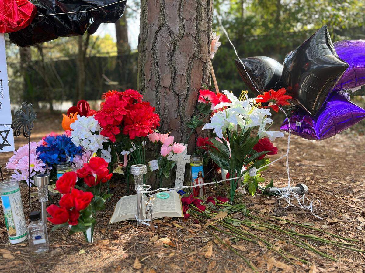 Candles, a bible, stuffed animals and other mementos were left by friends and family underneath the trees near where the body of Darryal Grant. Jr., 25, of Hilton Head, was found on March 16.