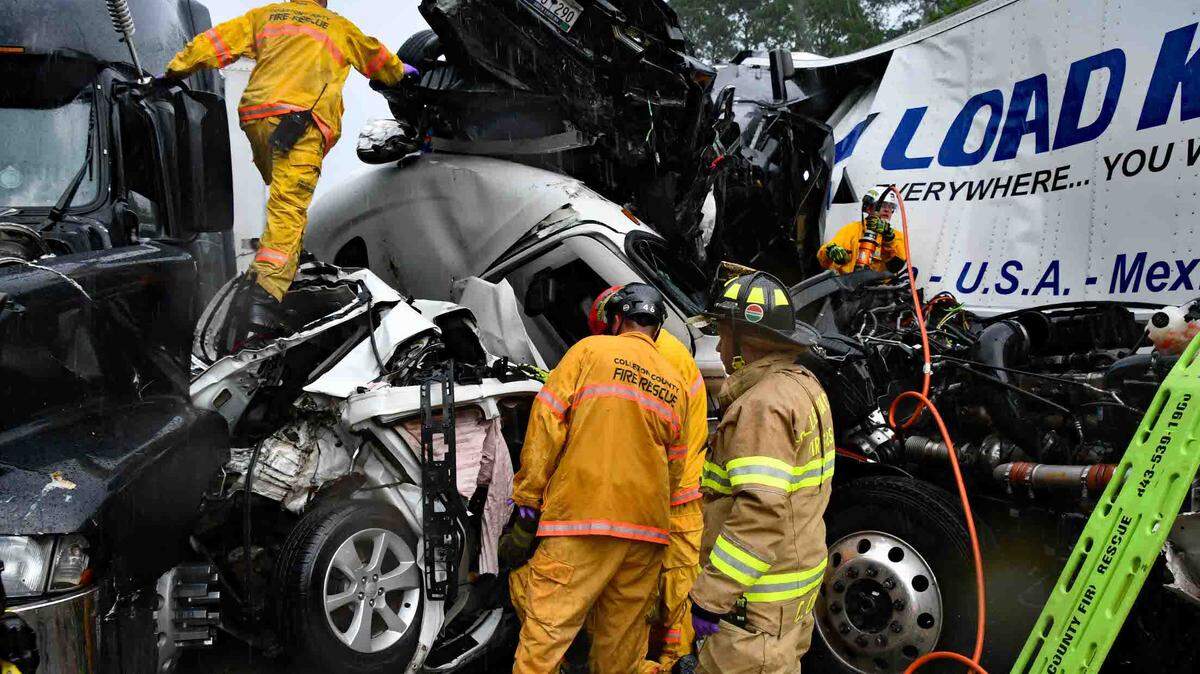 First responders were pictured climbing through the wreckage after a deadly pileup on I-95 the afternoon of July 22, 2025 near Yemassee. Two people died in the crash, which happened as heavy thunderstorms swept through the Lowcountry that afternoon. Witnesses reported blinding rains and near-zero visibility on the interstate.