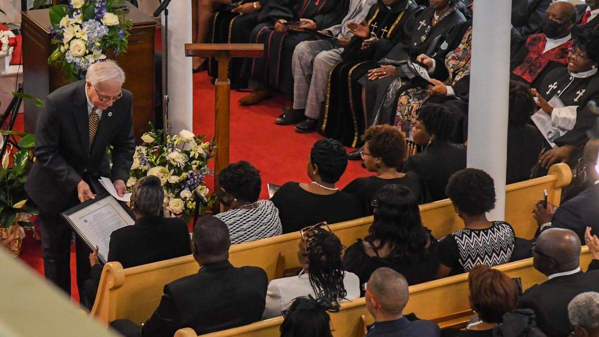 City of Beaufort Mayor Phil Cromer hands Patricia Hodges a framed city proclamation at her husband’s funeral declaring the day, May 3, 2025, as ‘Kenneth Hodges Day’ at the Tabernacle Baptist Church in Historic Downtown Beaufort.