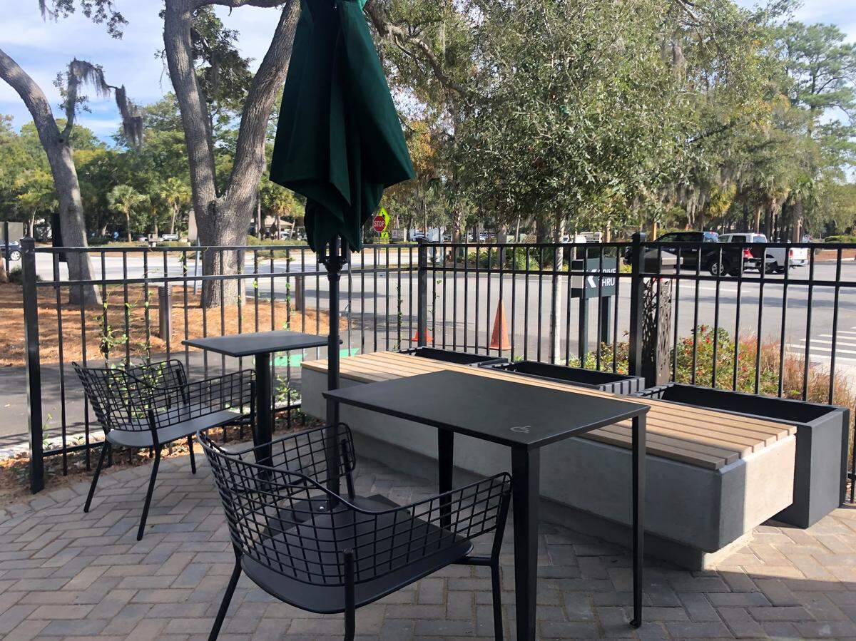 An outdoor seating area is being set up at the Sea Turtle Marketplace Starbucks on Hilton Head Island.