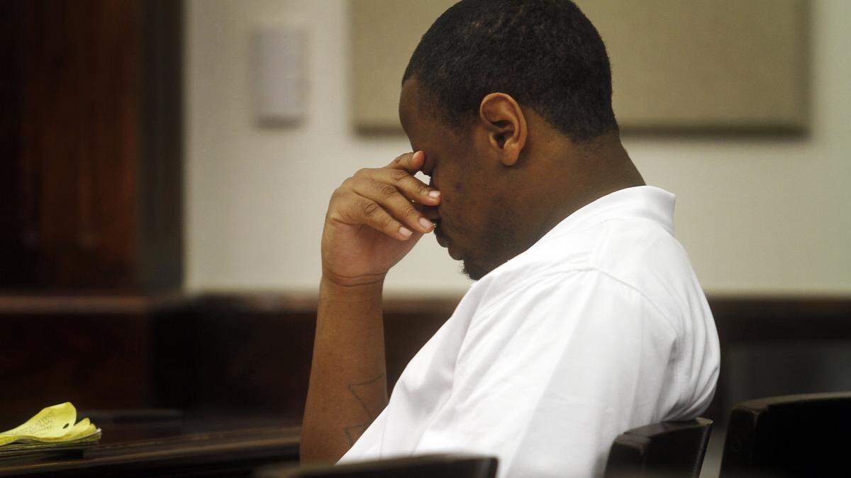 Lucas Miles Morgan, 27, rubs his eyes during a recess after the closing arguments while on trial at The Beaufort County Courthouse on Sept. 18, 2014.