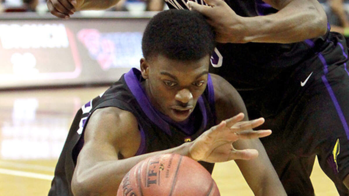 Whale Branch's Dee Delaney, top, and Marcus Bell hustle for a loose ball against Lewisville in the first half of the Class 1-A state championship game at the Colonial Life Arena in Columbia.