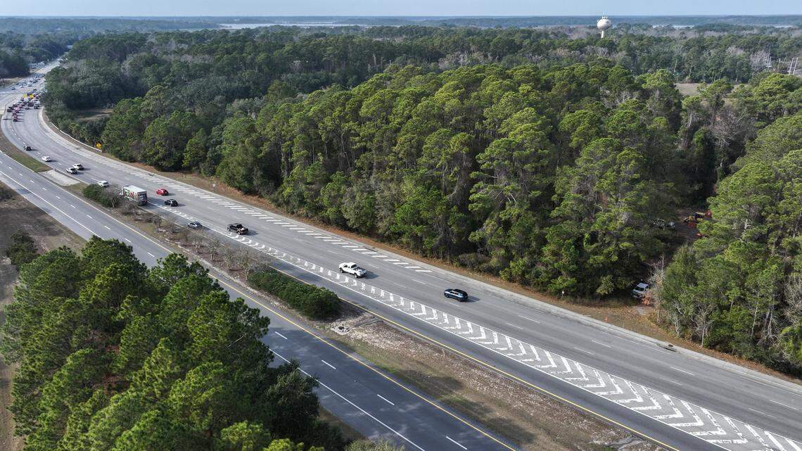 A crew for construction mobilization and site work can be seen tucked into the woods, right, for Northpoint on Jarvis Creek as westbound traffic moves along U.S. 278 near the Cross Island Parkway. The Town of Hilton Head Island and One Street Residential have reached an agreement for a 65-year ground lease for a 157-unit workforce housing development on 11 acres owned by the town.