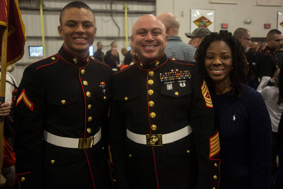 Pfc. Jalen Rooks, left, poses for a picture with his father, Master Sgt. (ret.) David Rooks, and his mother, Latasha Rooks, after he graduated from boot camp Friday, Dec. 14, 2018, at Marine Corps Recruit Depot Parris Island, S.C.
