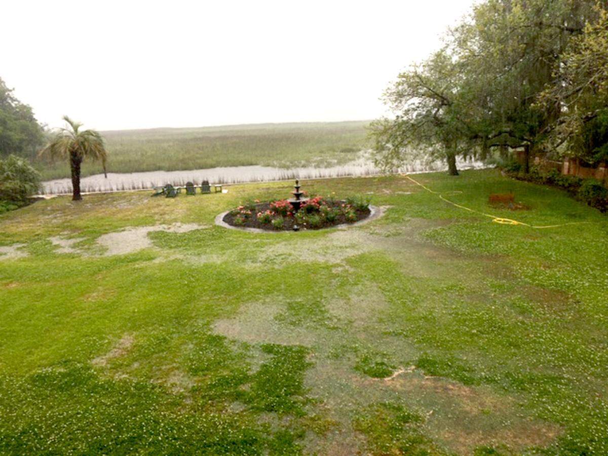 After a heavy rain in April, 2020, the Amaro’s backyard, even with water pumps and yard drains, ponds with water in Beaufort’s historic neighborhood The Point.