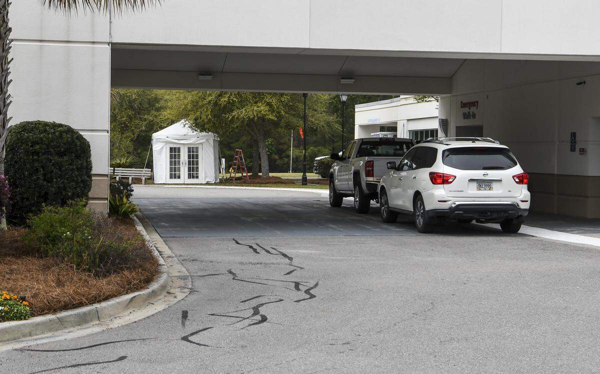 A small tent sits on the other side of the emergency room entance at Coastal Carolina Hospital as seen on Monday, March 23, 2020, presumably to treat patients who may potentially have COVID-19 as the coronavirus pandemic sweeps the nation.