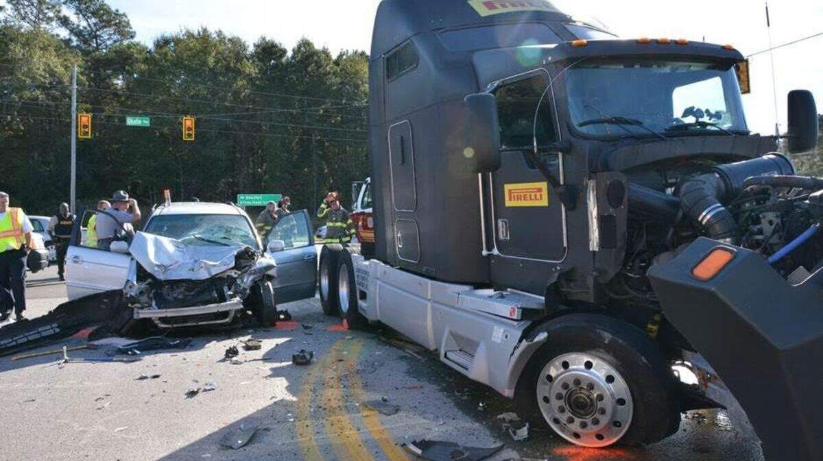 Bluffton Township Fire District and Beaufort County EMS personnel work the scene of a wreck at Argent Boulevard and SC 170 the morning of Nov. 16, 2015. A tractor trailer and minivan collided, with one person trapped in the van. A medical helicopter was called to the scene.