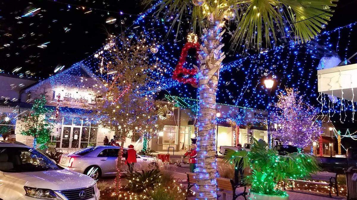 Patrons enjoy the Dove Street Lights in 2014, their first year at their new location at Shelter Cove Towne Centre. 