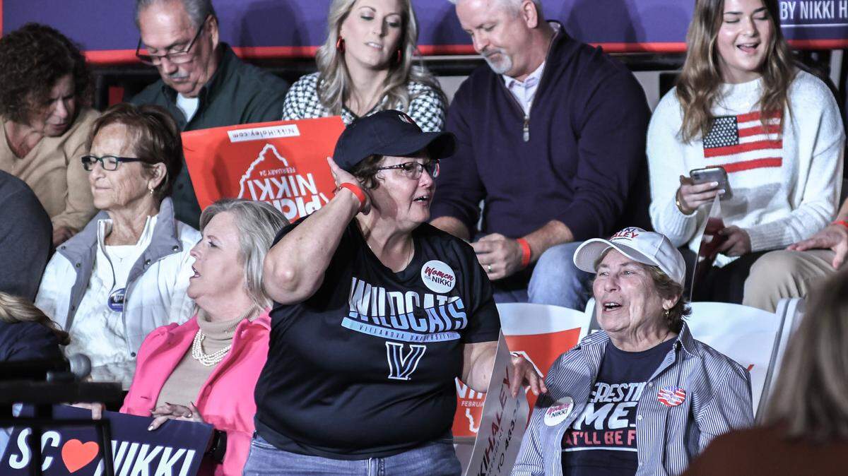 A woman attempts to get the crowd excited before the entrance of former U.S. Ambassador and S.C. Gov. Nikki Haley’s arrival for her 2024 Presidential Town Hall at USCB’s Sand Shark Recreation Center on Monday, Nov. 27, 2023 in Bluffton.