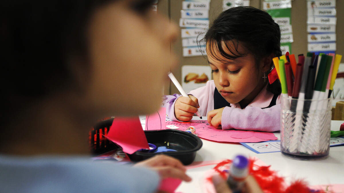 Hilton Head Island Early Childhood Center pre-k students Gibelle Paco Santos, 5, right, and Aidan Pozos, 5, decorate Valentine hearts during a recent class.