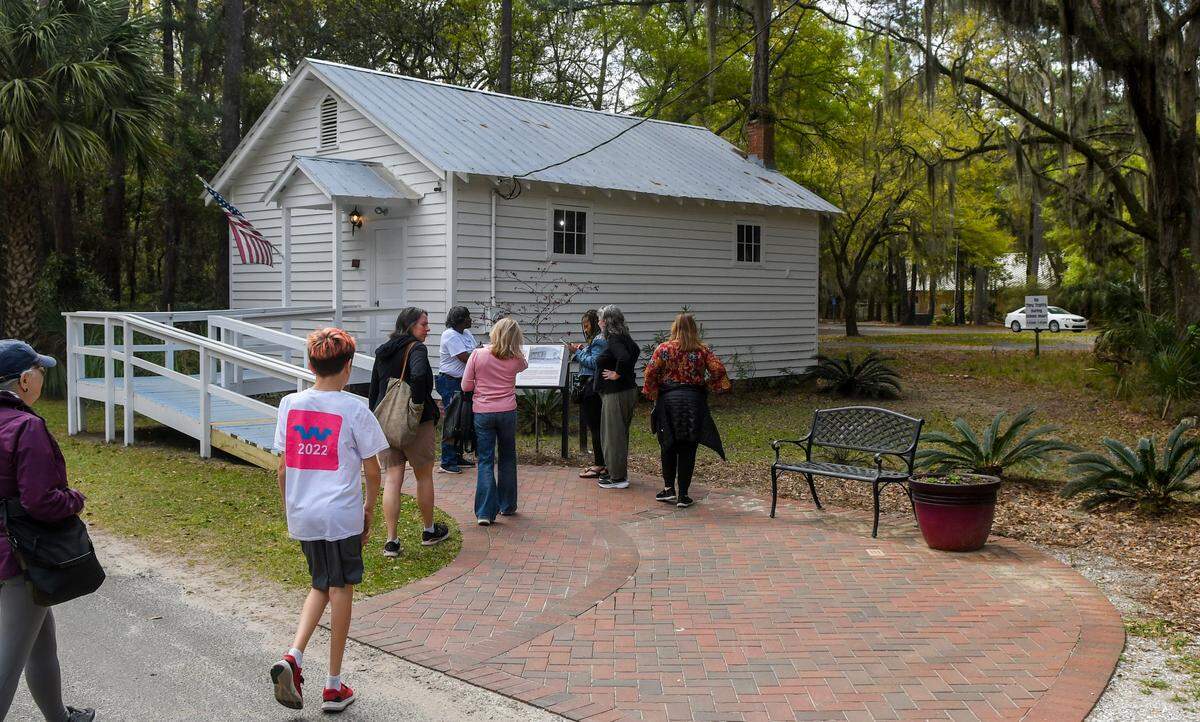 Authentic Gullah Tour by Sallie Ann Robinson leads a group to the Jane Hamilton School on Tuesday, March 26, 2024 on Daufuskie Island. The building was restored by the Daufuskie Island Historical Foundation and currently houses the Gullah Learning Center and the Daufuskie Island Community Library.