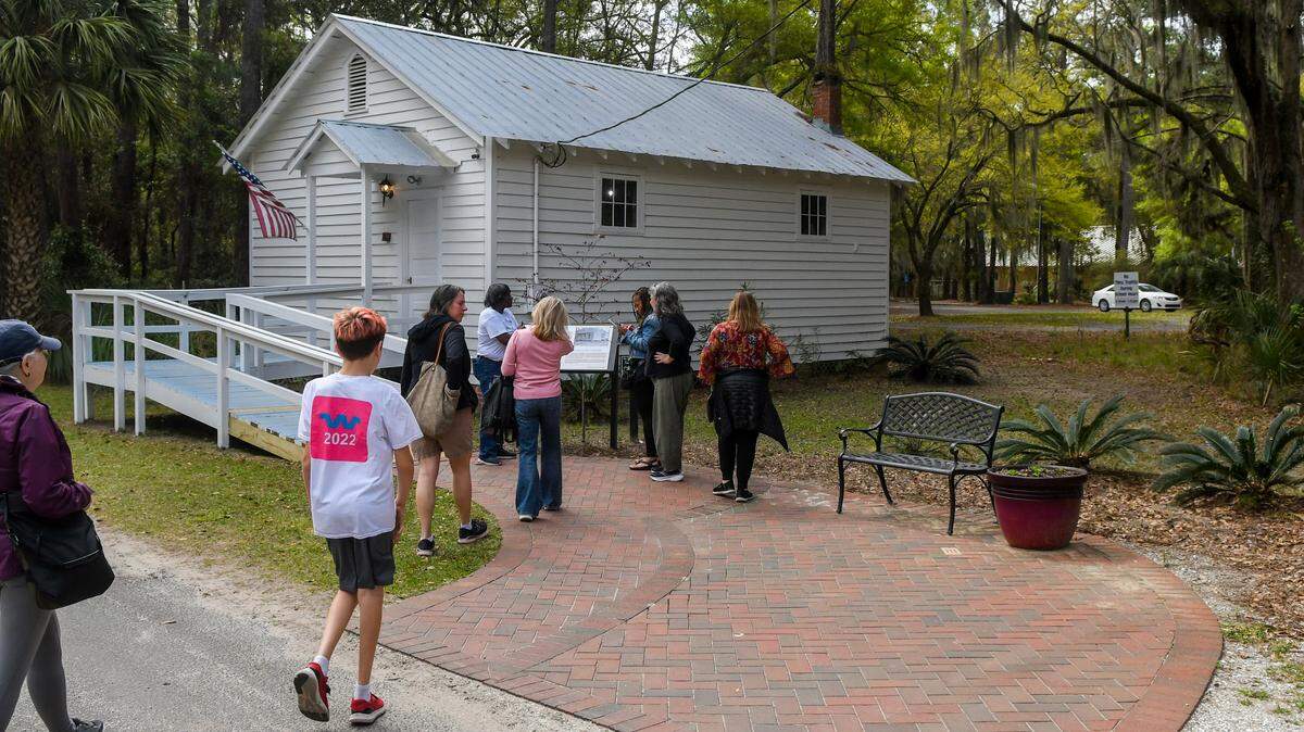 Authentic Gullah Tour by Sallie Ann Robinson leads a group to the Jane Hamilton School on Tuesday, March 26, 2024 on Daufuskie Island. The building was restored by the Daufuskie Island Historical Foundation and currently houses the Gullah Learning Center and the Daufuskie Island Community Library.