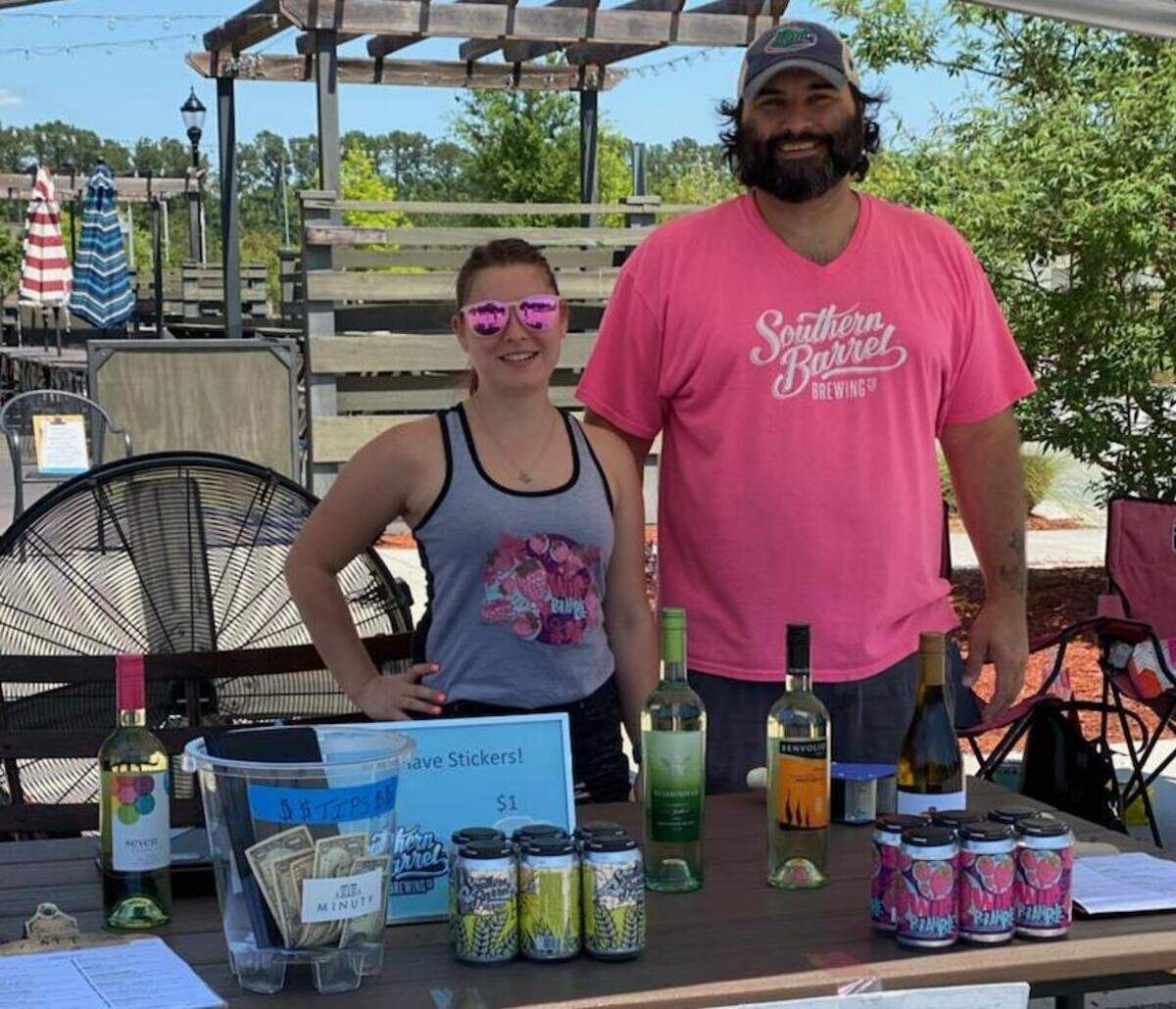 Michael Hodge, general manager of Southern Barrel Brewing Co. in Bluffton, with Sabrina Madara on April 25, 2020 during the drive-thru artisan market sponsored by Lowcountry Made.
