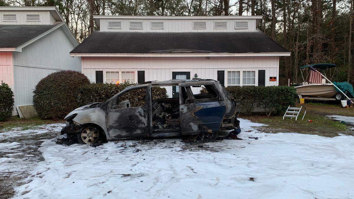 A Toyota van that burned in a fire late Sunday afternoon sits in front of a Lady’s Island home. Firefighters extinguished the flames, and a man inside the vehicle was taken to the hospital.