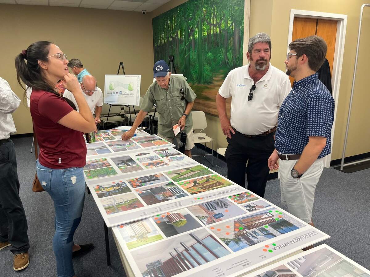 Port Royal Councilman Jerry Ashmore, second from right, discusses plans to improve Paris Avenue last week. The town is planning a $16 million improvement to the street, its largest capital improvement ever.