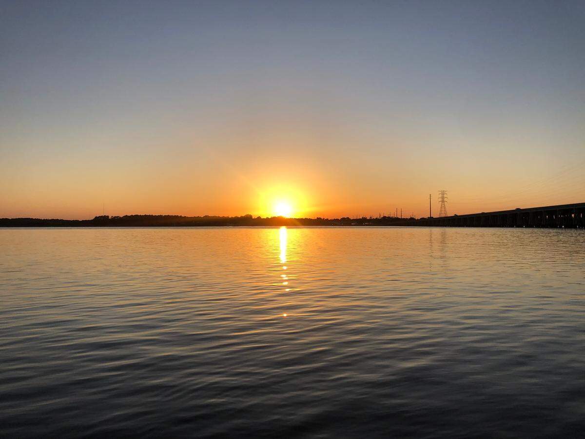 The unfettered view of the sunset over Mackay Creek from the C.C. Haigh Jr. boat landing.