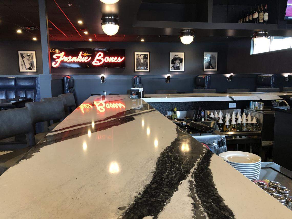 The restaurant has bar seating and high-top tables in addition to the more private booths.