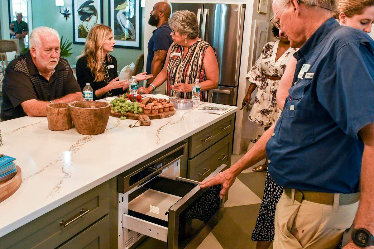 Instead of having a microwave on the counter or above a stove, Allen Patterson shows a GE Profile microwave drawer just below the kitchen’s island.