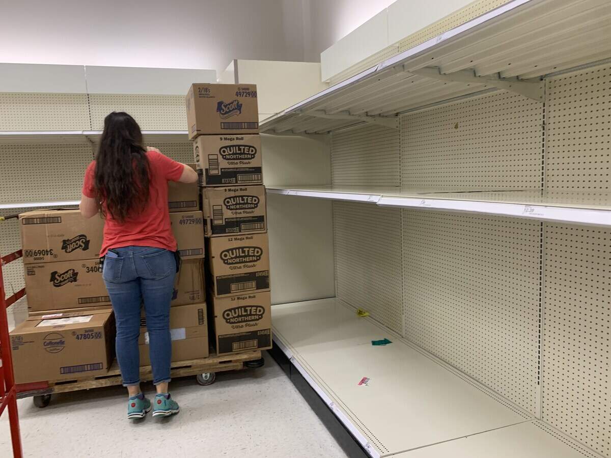 An employee at the Bluffton Target worked to restock the shelves with toilet paper on March 13, 2020.