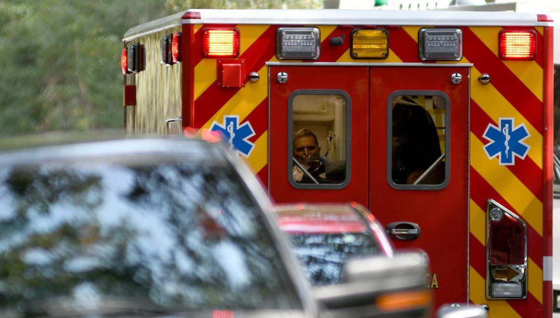 A man wearing what appears to be a flight suit with an squadron patch similar to that of the Marine Corps Air Station Beaufort unit that flies the F-35B fighter jet leaves Friday afternoon in a Marine Corps Air Station Fire and Rescue ambulance. Law enforcement at the scene confirmed that the pilot of the crashed jet was still on the scene when media arrived on Clarendon Road in the Grays Hill area.