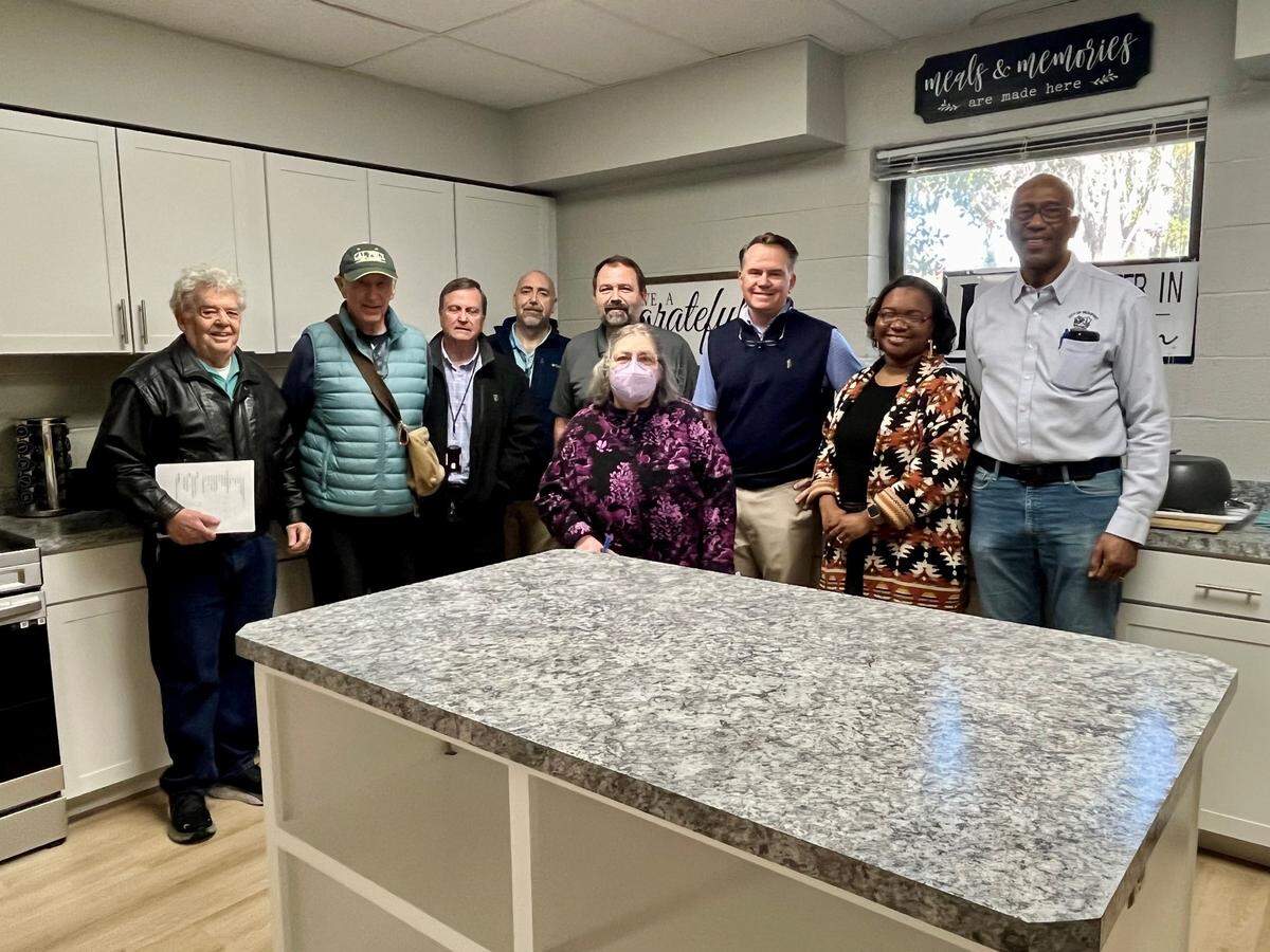 Beaufort County and Beaufort residents involved in the improvement at the Charles Lind Brown Center pose for a photo in one of the renovated kitchen facilities. Left to right: Dan Blackman, president Northwest Quadrant Neighborhood Association; Bill Suter, resident of the Northwest Quadrant Neighborhood Association; Robert Roseneau, Beaufort County facility management director; Eric Larson, Beaufort County capital improvement projects director; Robert Gecy, Beaufort County project manager,Beaufort County; Hank Amundson, Beaufort County special assistant to the interim administrator; Alana Jenkins, chairwoman of the Friends of the Charles Lind Brown Community Center. Front: Peggy Simmer, secretary of the Old Commons Neighborhood Association.