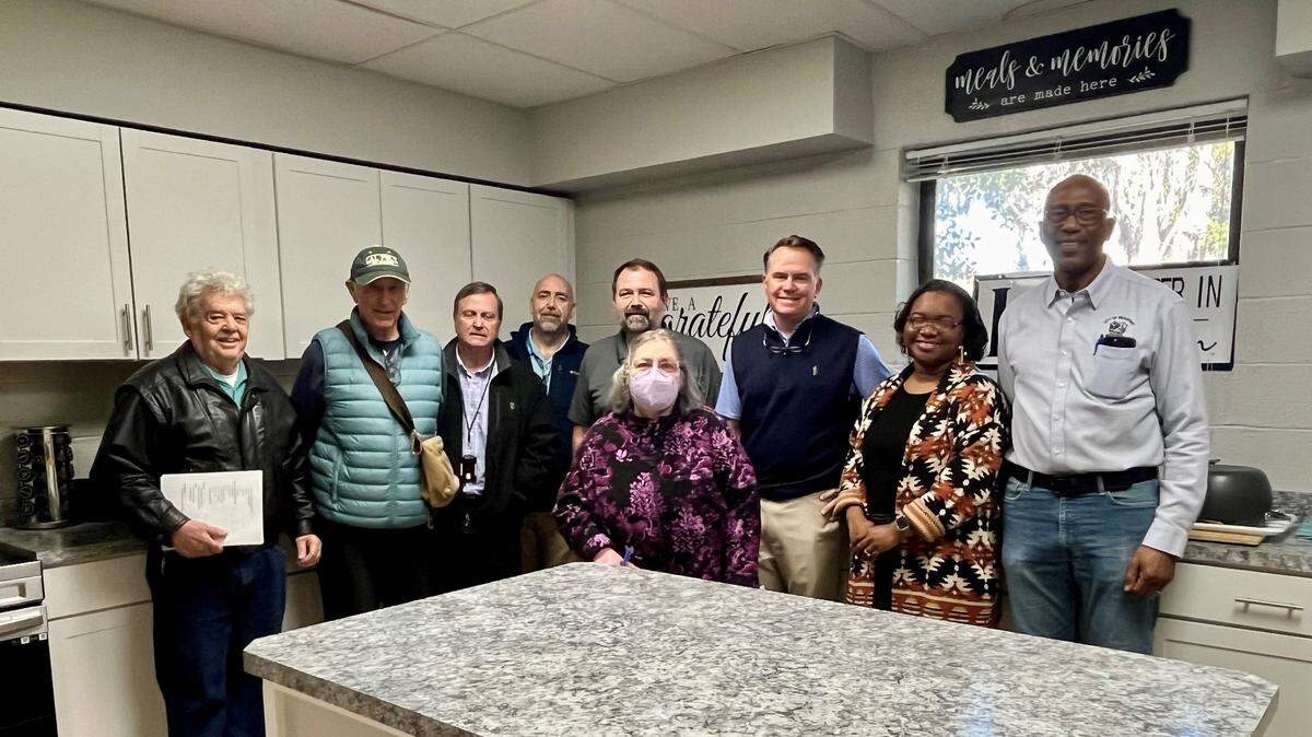 Beaufort County and Beaufort residents involved in the improvement at the Charles Lind Brown Center pose for a photo in one of the renovated kitchen facilities. Left to right: Dan Blackman, president Northwest Quadrant Neighborhood Association; Bill Suter, resident of the Northwest Quadrant Neighborhood Association; Robert Roseneau, Beaufort County facility management director; Eric Larson, Beaufort County capital improvement projects director; Robert Gecy, Beaufort County project manager,Beaufort County; Hank Amundson, Beaufort County special assistant to the interim administrator; Alana Jenkins, chairwoman of the Friends of the Charles Lind Brown Community Center. Front: Peggy Simmer, secretary of the Old Commons Neighborhood Association.