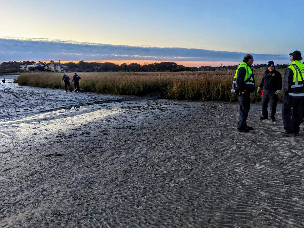 Ruth McCully is rescued while hip-deep in pluff mud at Fish Haul beach on Hilton Head Island on Jan. 18, 2021.