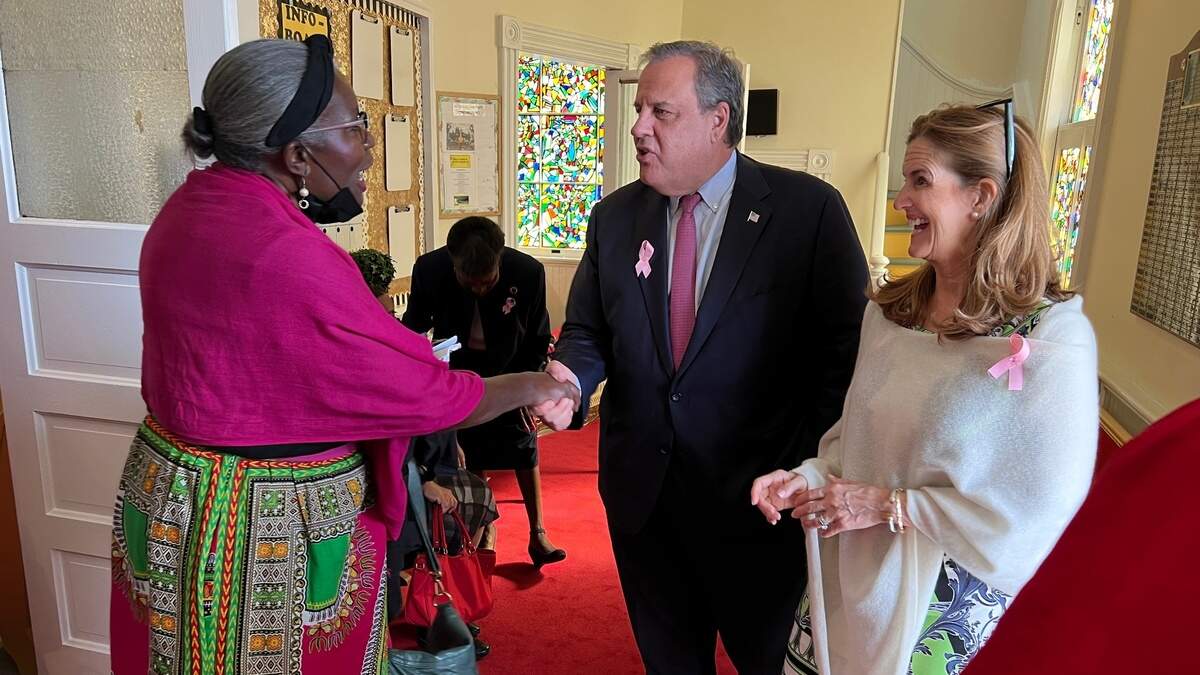 Barbara Washington shakes the hands of former New Jersey governor and GOP presidential candidate Chris Christie and wife Mary Pat Christie after Sunday worship at Tabernacle Baptist Church in Beaufort, South Carolina.