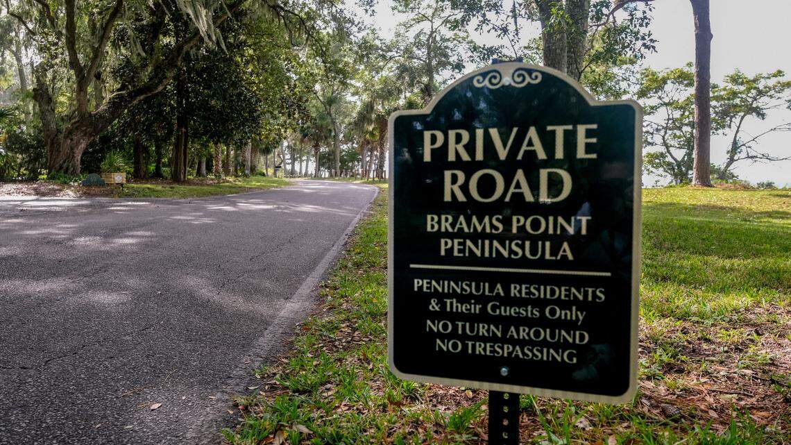 A sign alerts drivers that the one-lane road is exclusive to residents as seen on Wednesday, Nov. 11, 2020 in the non-gated community of Spanish Wells on Hilton Head Island. The one-lane road takes those onto a peninsula where residents of mansions have scenic views of Calibogue Sound and Broad Creek.