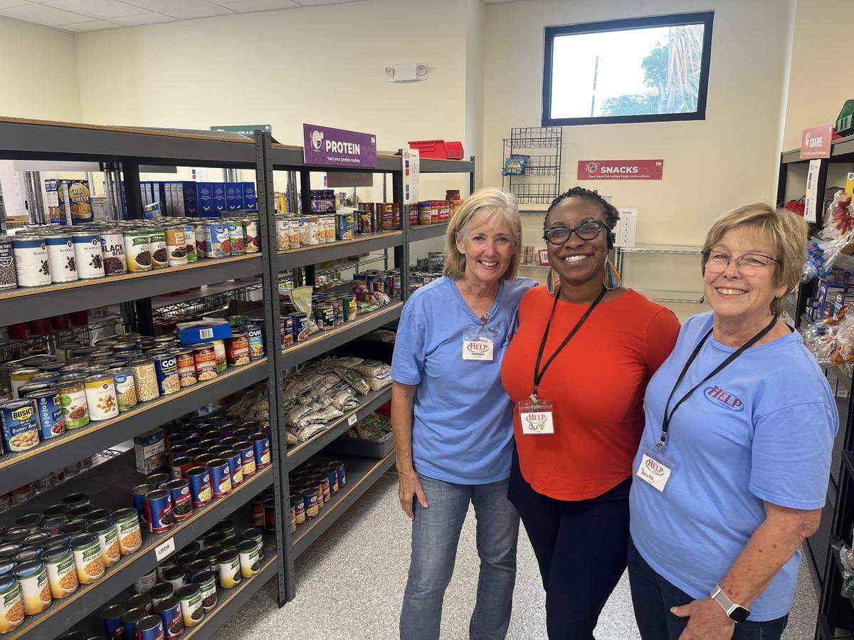 From left, Barbara Rhymaun, Shquina Holmes and Donna Mical at HELP of Beaufort food pantry. Mical and Rhymaun are volunteers. Holmes is assistant manager. “It’s going to be a serious problem for some of these folks,” if federal food benefits are cut as a result of the government shutdown, Rhymaun says