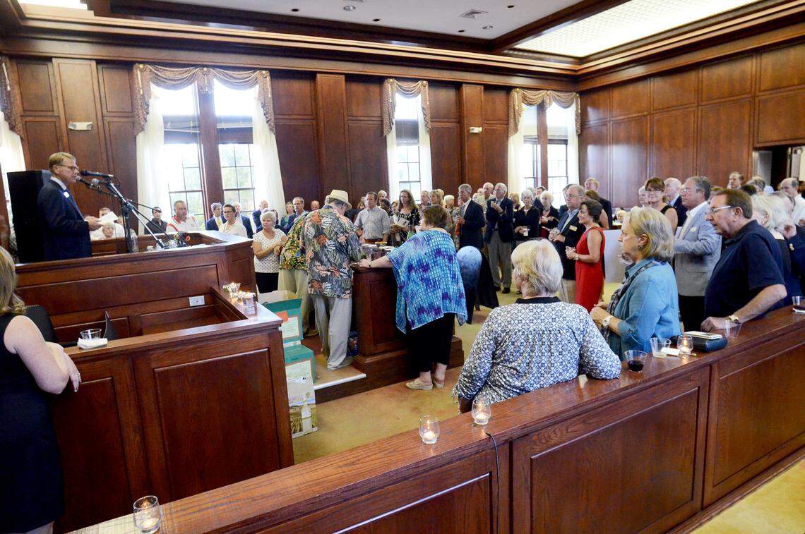Attendees gather in the courtroom of the former Federal Courthouse on Bay Street, Beaufort, as Santa Elena Foundation Executive Director Andrew Beall, left, speaks Oct. 8, 2015, during the foundation's "Celebrate the Space" event in its new building. Plans call for the courtroom to be converted into exhibition space for the foundation's museum.