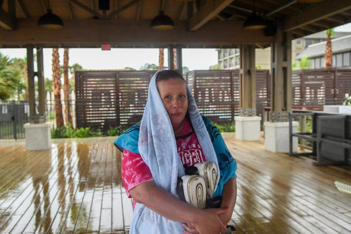 Genee Leonard stands for photo sheltering from tropical Storm Debby at the Dunes Pavilion at Beach House Hilton Head Island on August. 5, 2024 on Hilton Head Island. Leonard and her family drove down to Hilton Head from West Virginia for the first time and will be here for the duration of the storm.