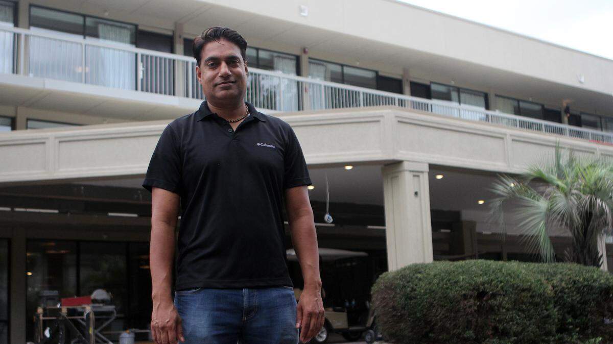 Sam Johal, owner of Hilton Head Hospitality LLC., stands in front of the mostly renovated Metropolitan Hotel annex on Saturday afternoon on Hilton Head Island.  The building is scheduled to open in a few weeks as a Hampton Inn.