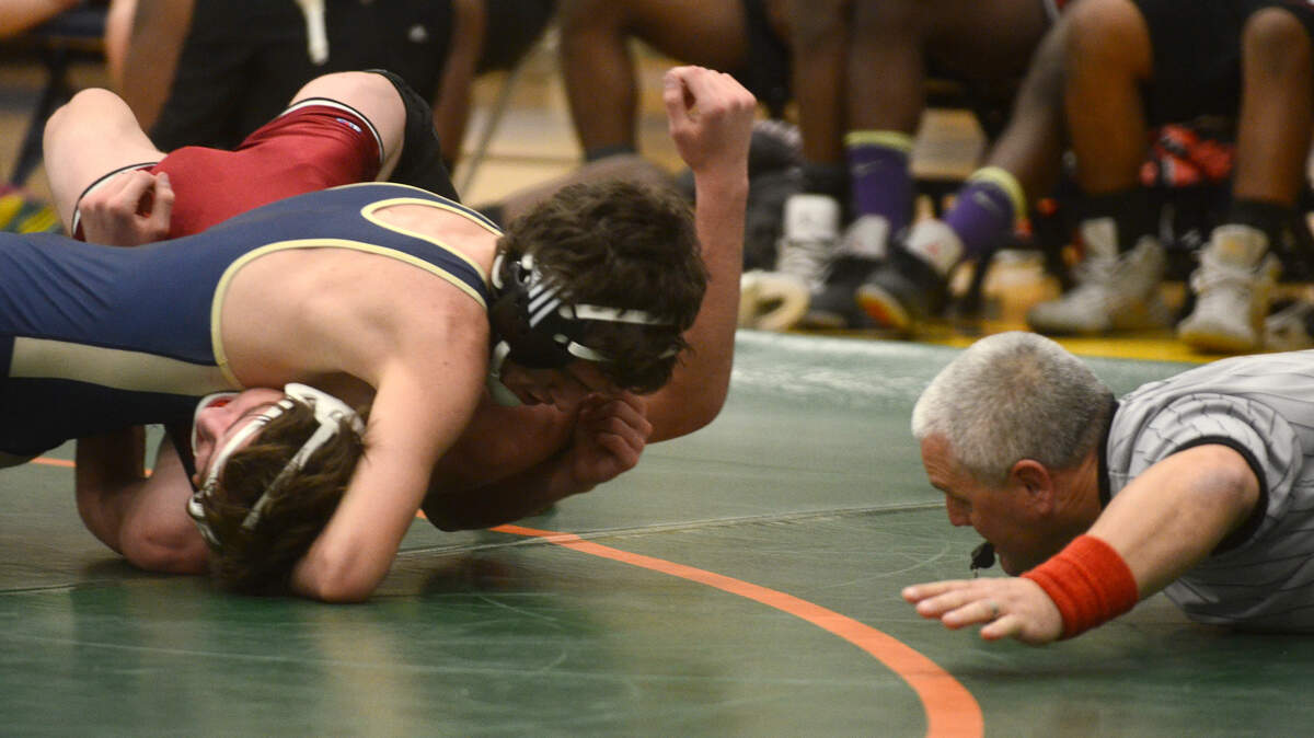 Battery Creek's Liam Payne tries to pin Bamberg-Ehrhardt's Dakota Kinsey during the 138-pound bout on Saturday afternoon during the finals in the Class 2-A/1-A Lower State wrestling tournament at Battery Creek High School in Beaufort.  Payne won the bout in a pin.