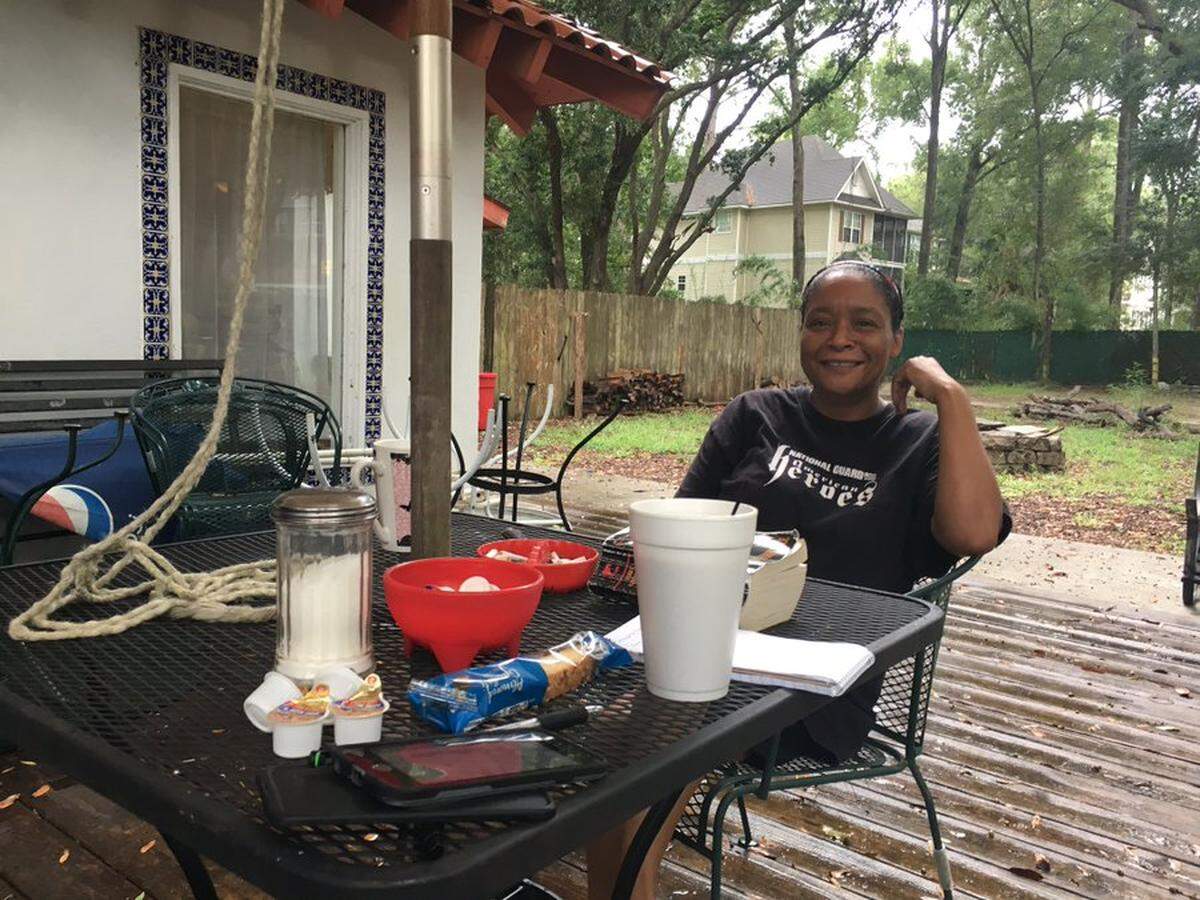 Mikki Rolain sits on the patio of her Hilton Head Island restaurant, Mikki’s Cafe on Wednesday morning. She and her husband stayed so they could make immediate repairs if needed.