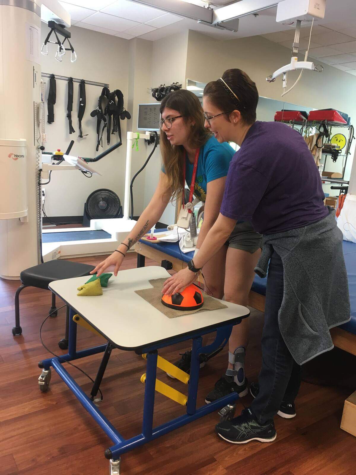 Serena Grumbine, 22, works on her fine motor skills in physical therapy on April 9, 2019 — four months after her first hospitalization for cavernomas in her brain.