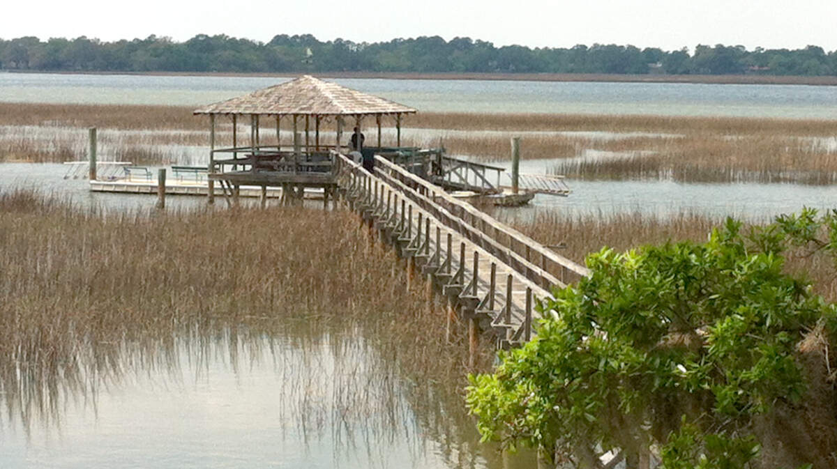 Chloe Pinckney and her friends relived the joys of childhood at her backyard dock in Beaufort's Pigeon Point neighborhood.