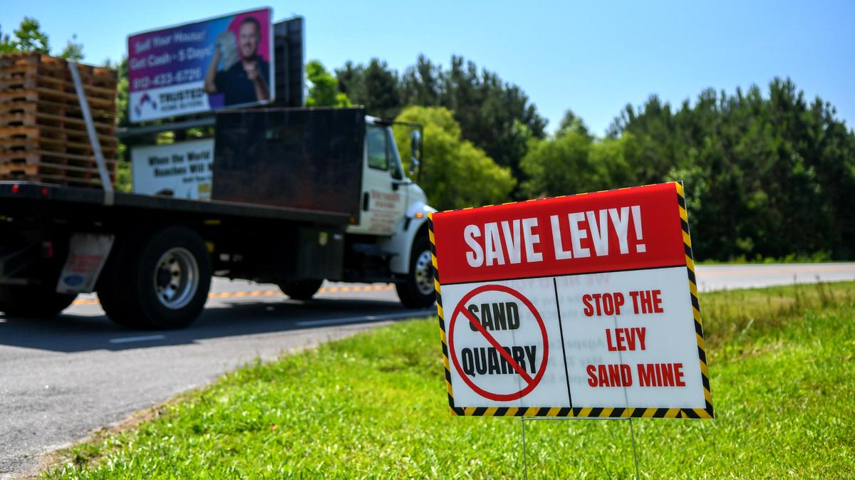 Signs along S.C. 315 in Jasper County raise awareness to a proposed sand mine that would be tucked in the forested area that abuts the private, gated community of Osprey Lake as photographed on May 20, 2025 in Levy, S.C.