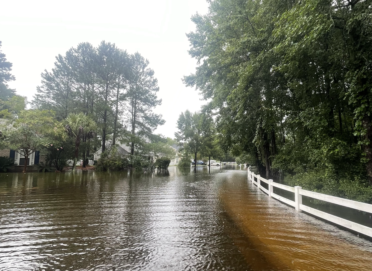 Floodwaters reached over sidewalks and halfway up roadside fences in The Farm at Buckwalter, a low-lying community in southern Bluffton. A photo taken Tuesday morning at the intersection of Old Bridge Drive and Mill Pond Road shows the extent of the neighborhood’s flooding as Tropical Storm Debby continued to bring huge amounts of rain to the Beaufort County area.
